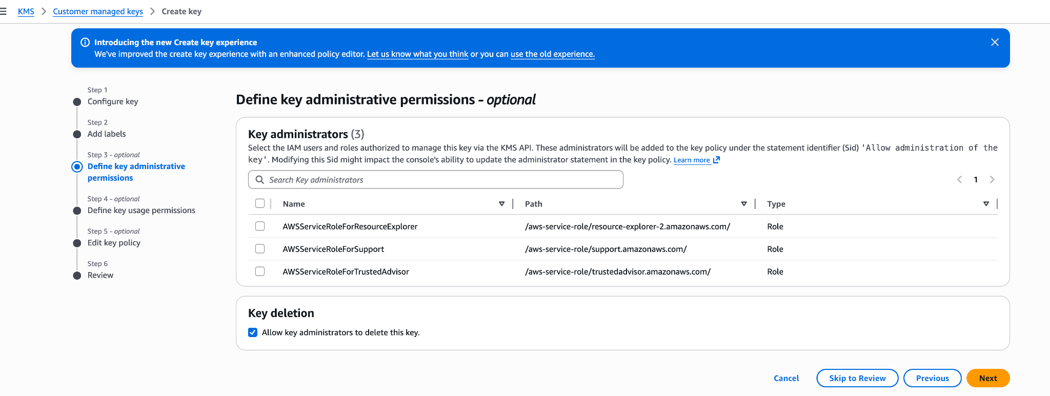 AWS KMS Define key administrative permissions step listing IAM roles that can administer the key.